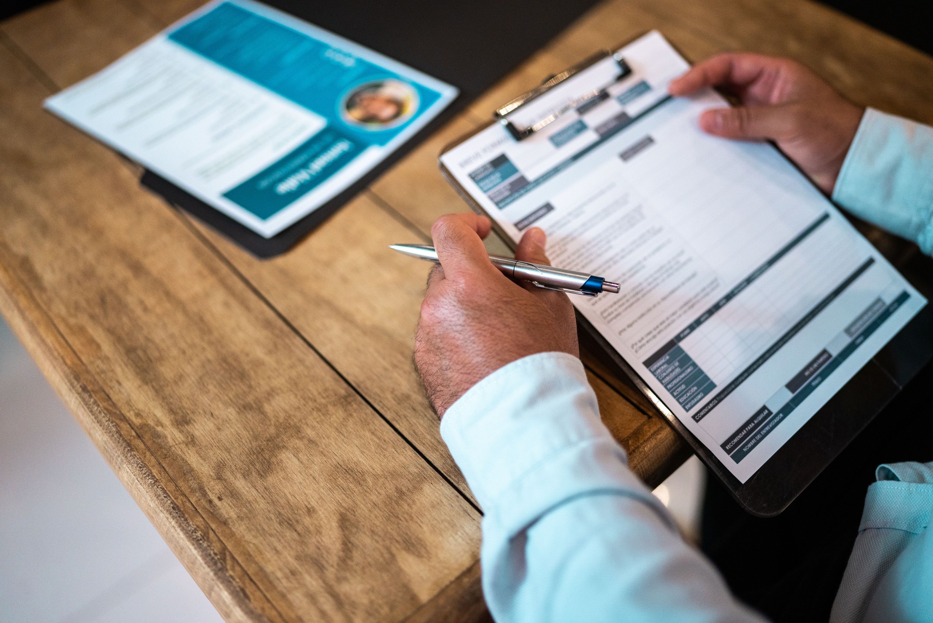 Close-up of a recruiter holding resume during interview job